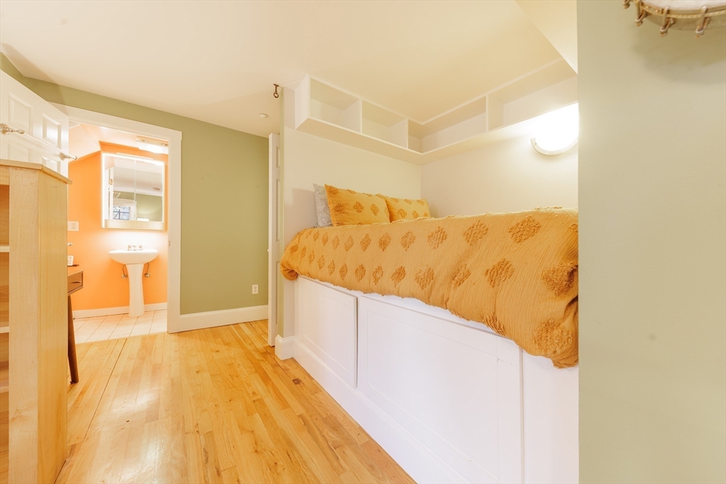 411 Norfolk Street, Unit 1F Somerville, MA 02143 - Photo 5 of 16 a bathroom with a tub and shower