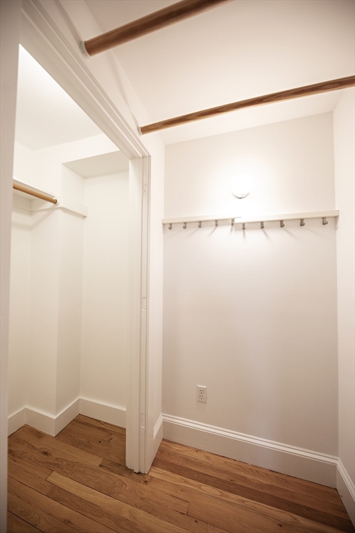 411 Norfolk Street, Unit 1F Somerville, MA 02143 - Photo 9 of 16 a view of small space with racks on the wall