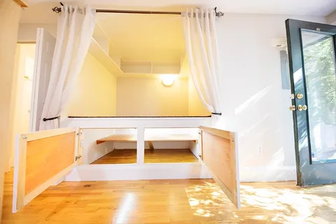 a bathroom with a tub and a window