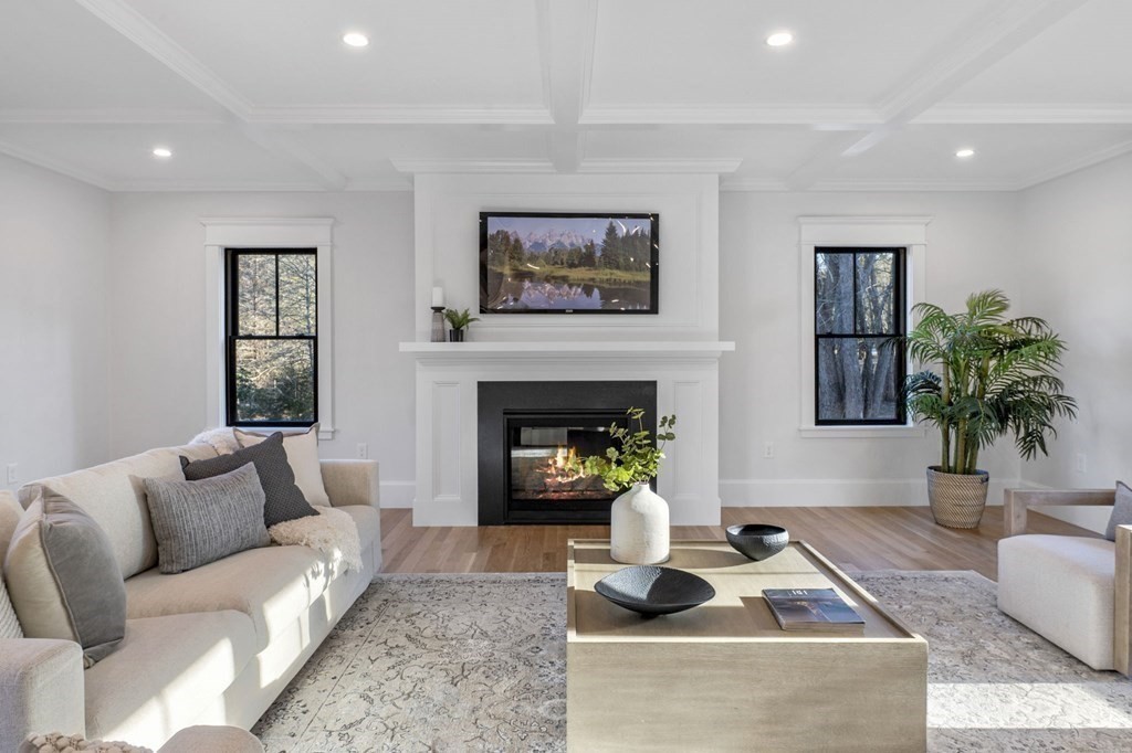 81 Sagamore Street Hamilton, MA 01982 - Photo 16 of 37 a living room with furniture and a fireplace
