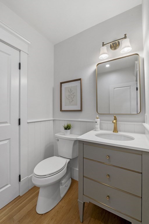 81 Sagamore Street Hamilton, MA 01982 - Photo 18 of 37 a bathroom with a toilet a sink and mirror