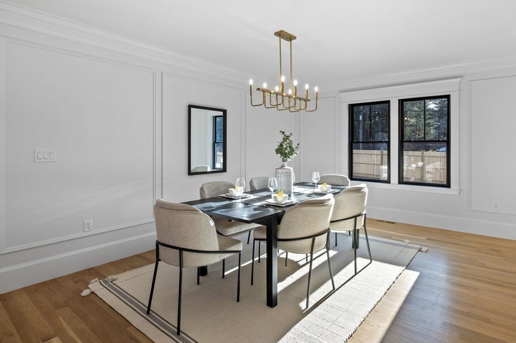 81 Sagamore Street Hamilton, MA 01982 - Photo 19 of 37 a view of a dining room with furniture wooden floor and chandelier