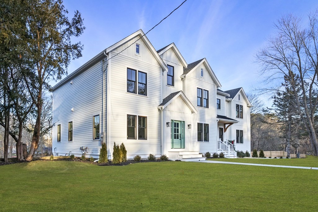 81 Sagamore Street Hamilton, MA 01982 - Photo 2 of 37 a front view of a house with a yard