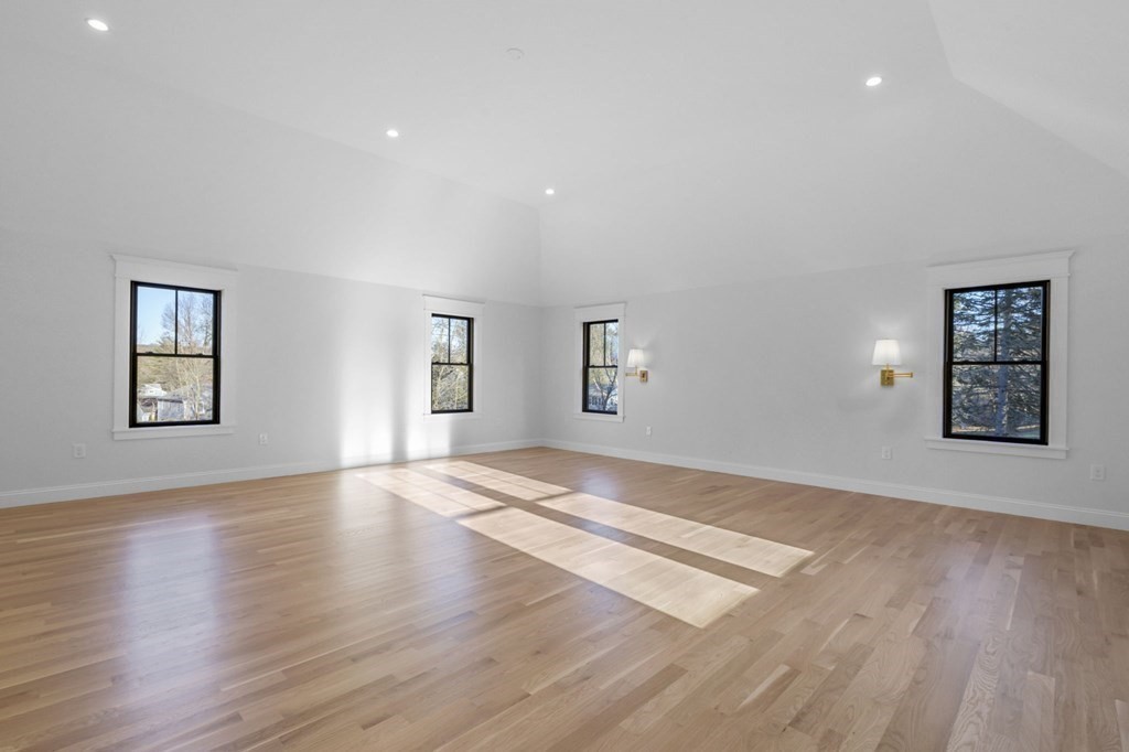81 Sagamore Street Hamilton, MA 01982 - Photo 21 of 37 a view of an empty room with wooden floor and a window