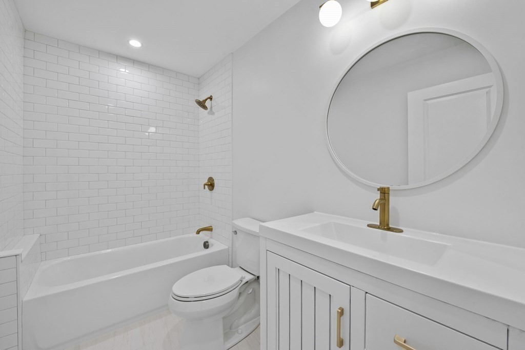 81 Sagamore Street Hamilton, MA 01982 - Photo 27 of 37 a bathroom with a sink a toilet and a mirror