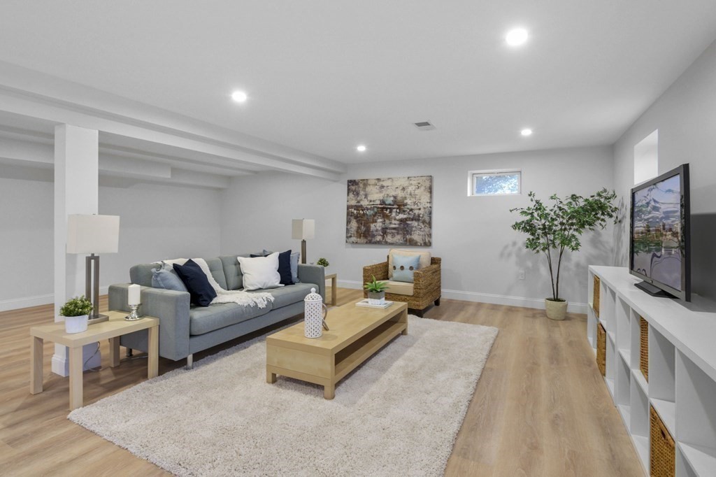 81 Sagamore Street Hamilton, MA 01982 - Photo 29 of 37 a living room with furniture and a flat screen tv