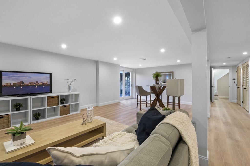 81 Sagamore Street Hamilton, MA 01982 - Photo 31 of 37 a living room with furniture and a table