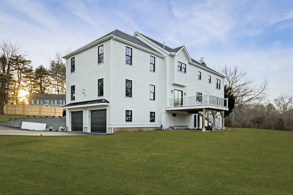 81 Sagamore Street Hamilton, MA 01982 - Photo 37 of 37 a front view of a house with a garden