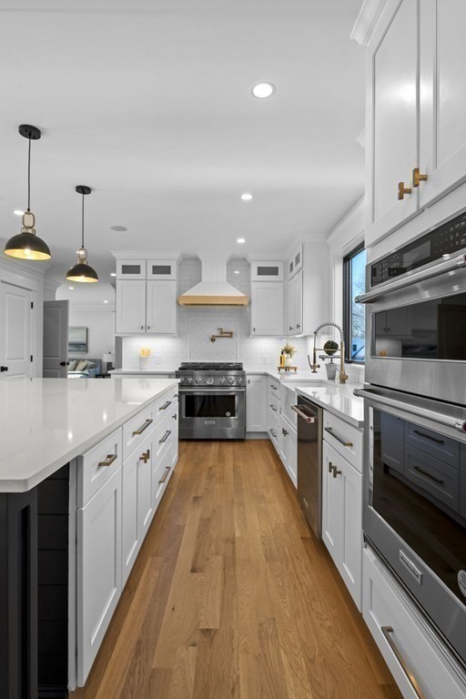 81 Sagamore Street Hamilton, MA 01982 - Photo 10 of 37 a large kitchen with cabinets and stainless steel appliances