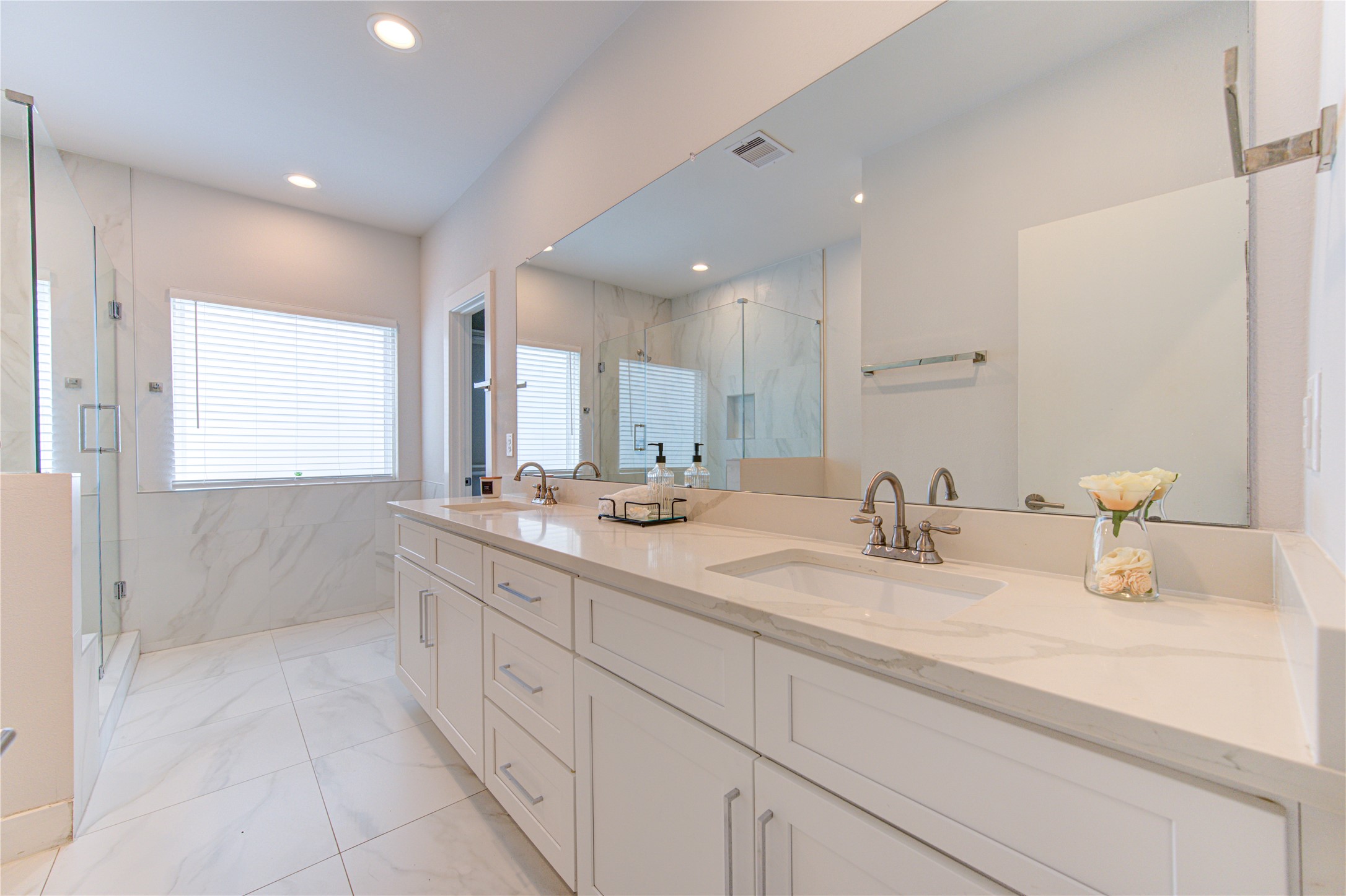 847 Rachel Street, Unit G Houston, TX 77091 - Photo 5 of 42 Luxurious primary bathroom with natural light, double sinks, walk-in shower, and premium finishes.