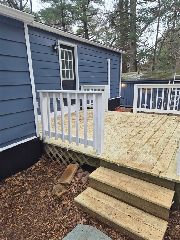 7 David Carver, MA 02330 - Photo 4 of 22 a view of a house with a wooden fence
