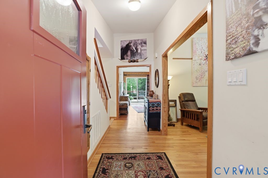 1061 Turkey Ridge Drive Moseley, VA 23120 - Photo 3 of 51 a hallway with a furniture and a rug