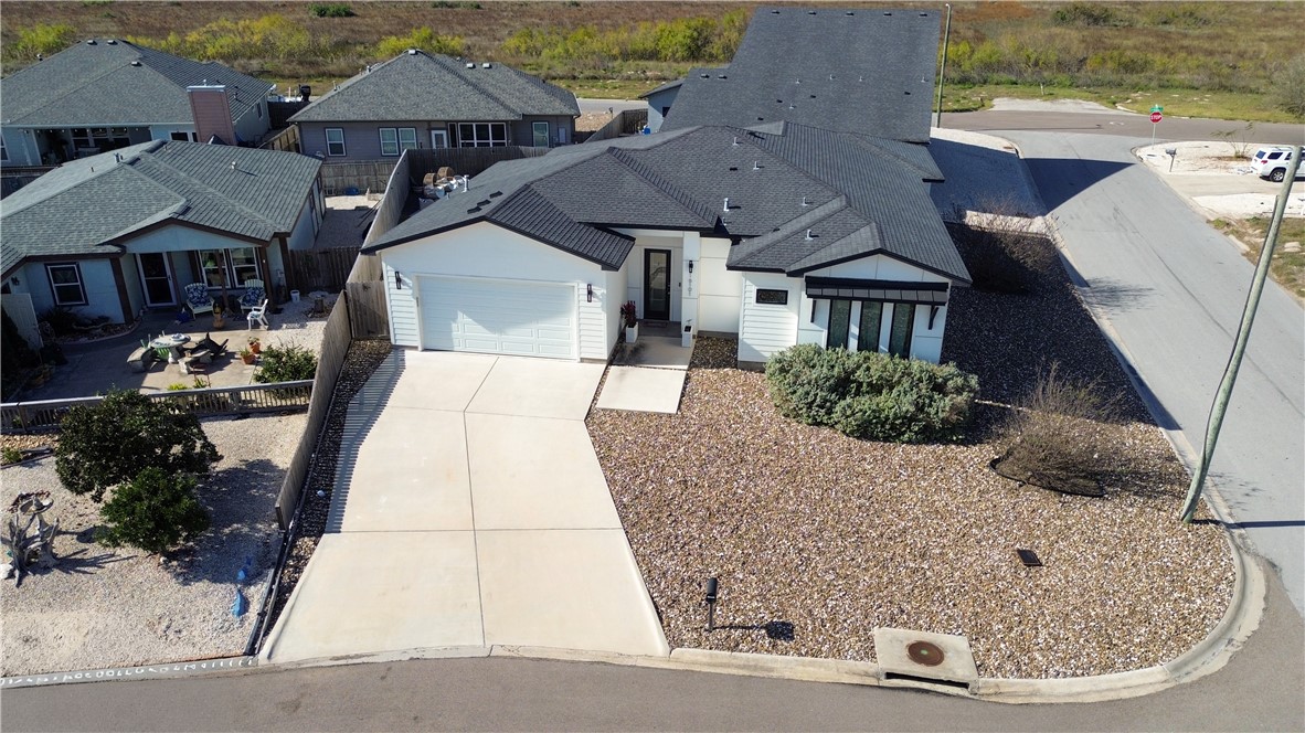 an aerial view of a house with swimming pool