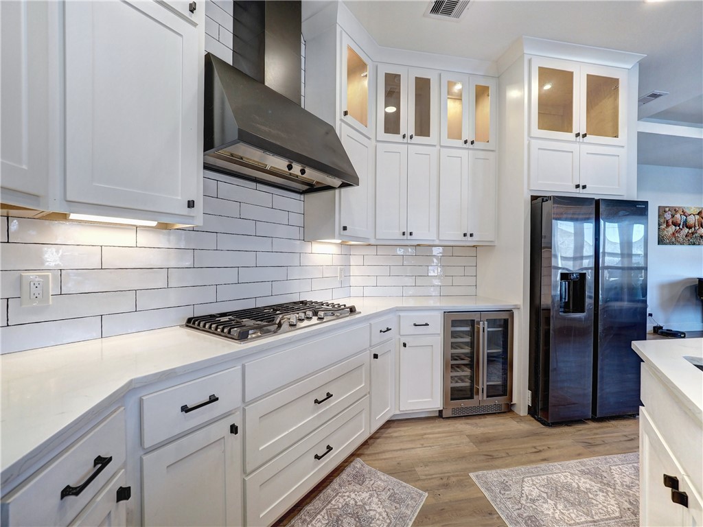 16101 Jessamine Street Corpus Christi, TX 78418 - Photo 12 of 29 a kitchen with cabinets and steel stainless steel appliances