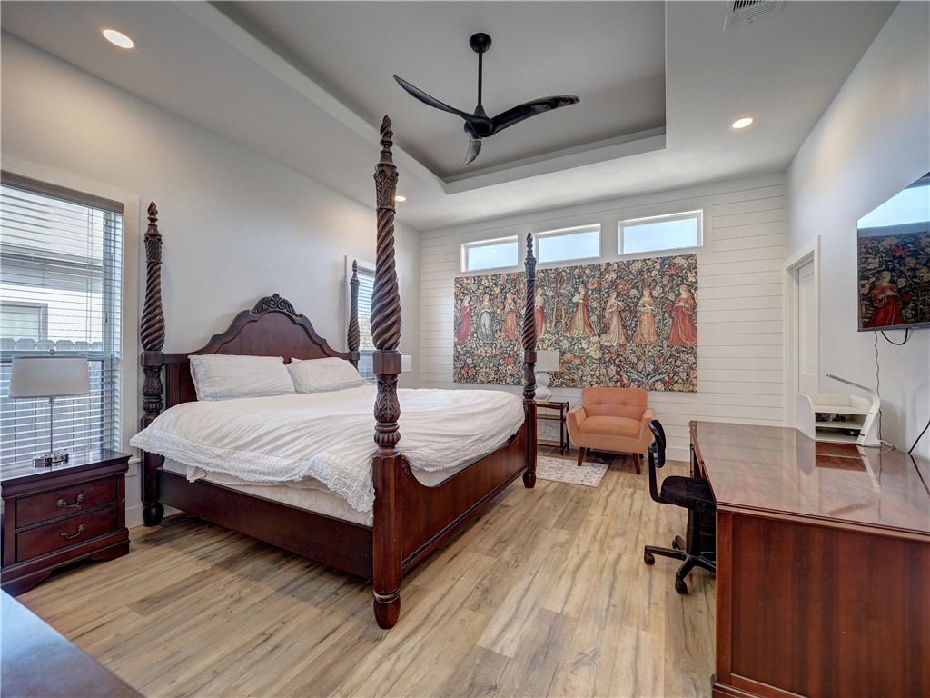 16101 Jessamine Street Corpus Christi, TX 78418 - Photo 16 of 28 a bedroom with a large bed and a desk