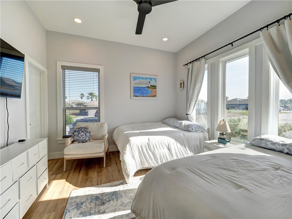 16101 Jessamine Street Corpus Christi, TX 78418 - Photo 22 of 28 a bedroom with a bed and a couch