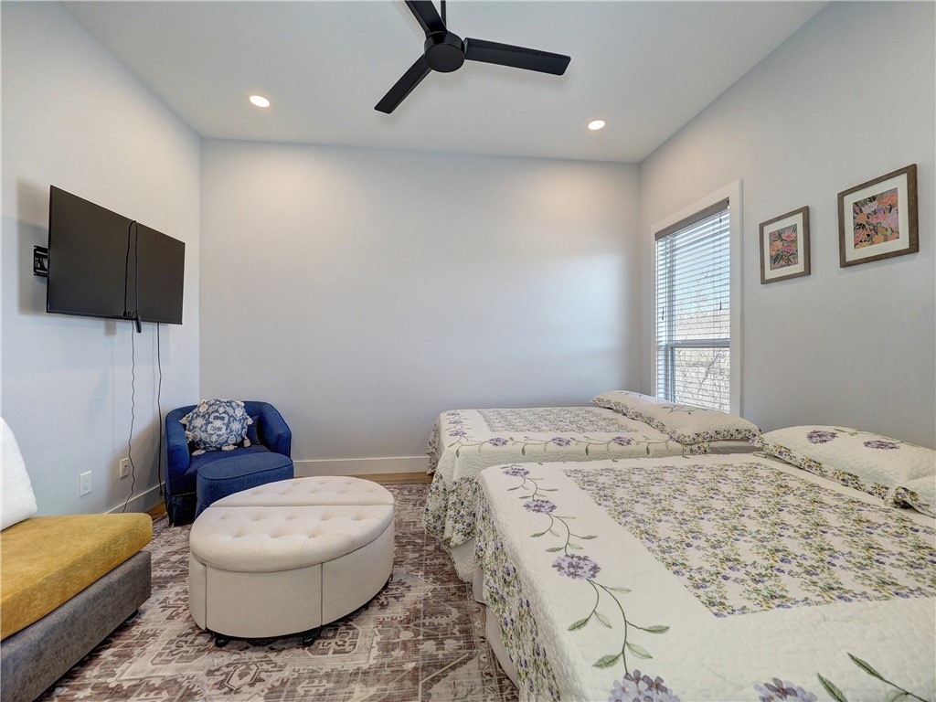 16101 Jessamine Street Corpus Christi, TX 78418 - Photo 23 of 28 a bedroom with a bed and a television