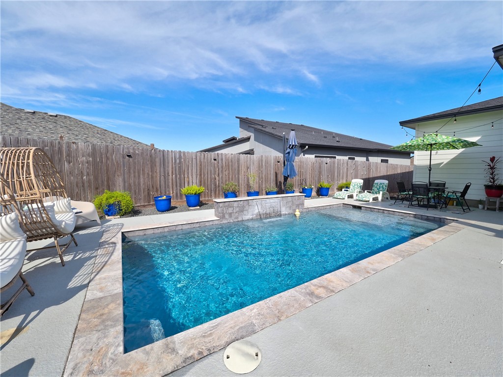 16101 Jessamine Street Corpus Christi, TX 78418 - Photo 27 of 28 a swimming pool with outdoor seating and yard