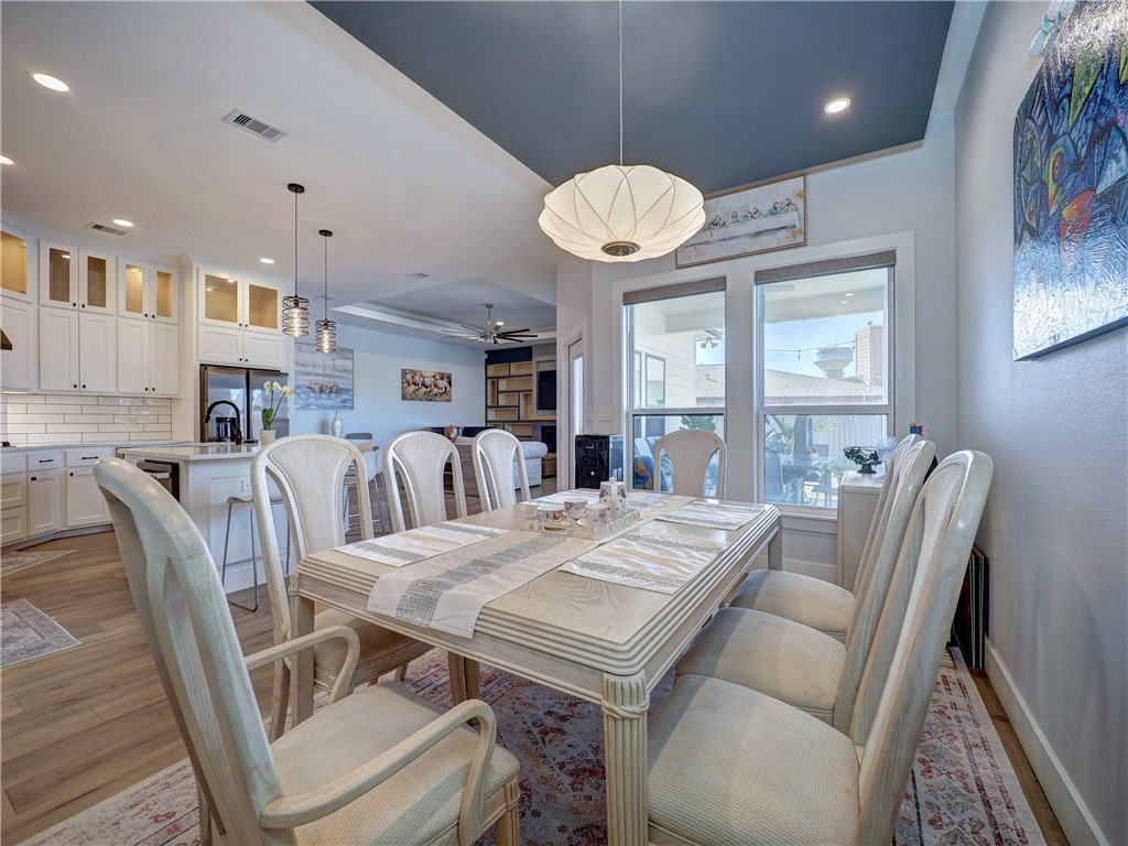 16101 Jessamine Street Corpus Christi, TX 78418 - Photo 10 of 28 a view of a dining room with furniture window and wooden floor