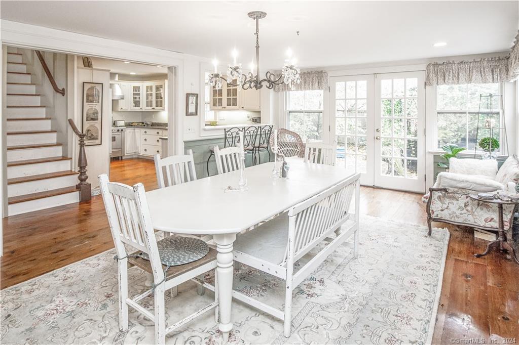 414 Riverside Avenue Westport, CT 06880 - Photo 11 of 40 a view of a dining room with furniture large windows and wooden floor
