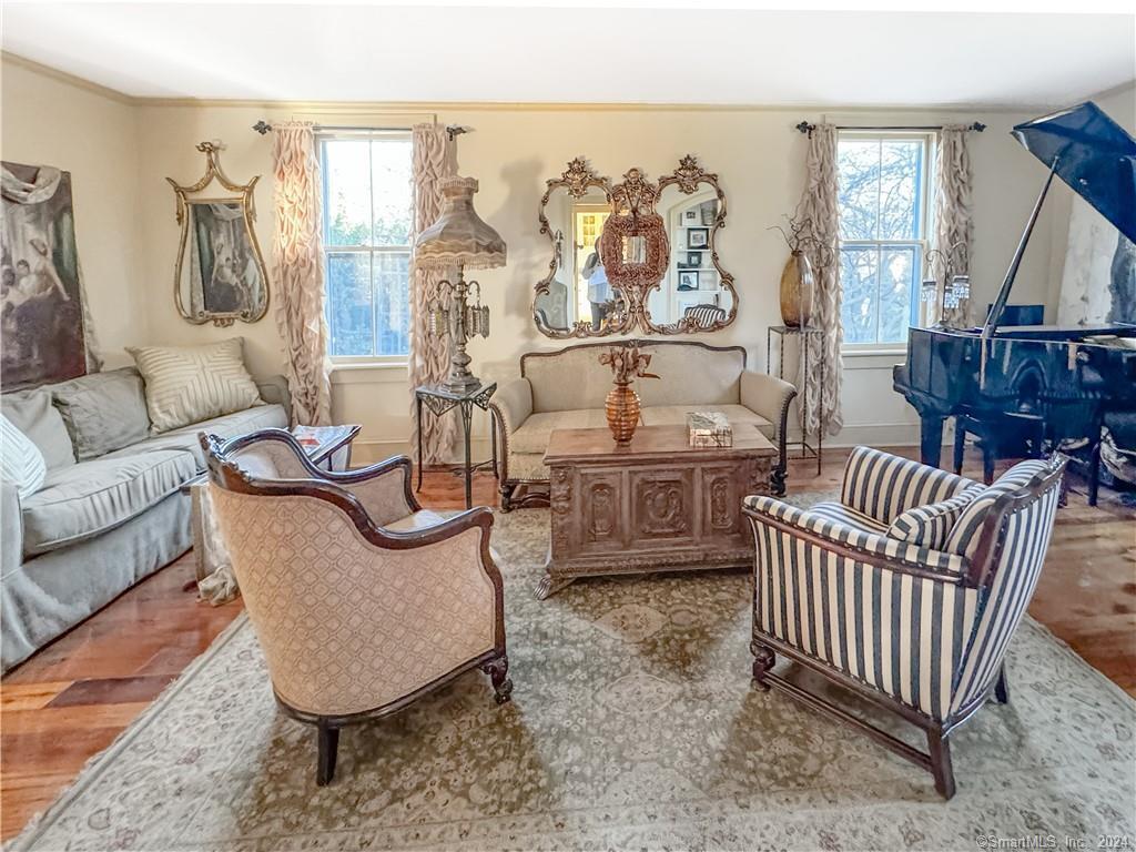 414 Riverside Avenue Westport, CT 06880 - Photo 15 of 40 a living room with furniture a couch and a floor to ceiling window
