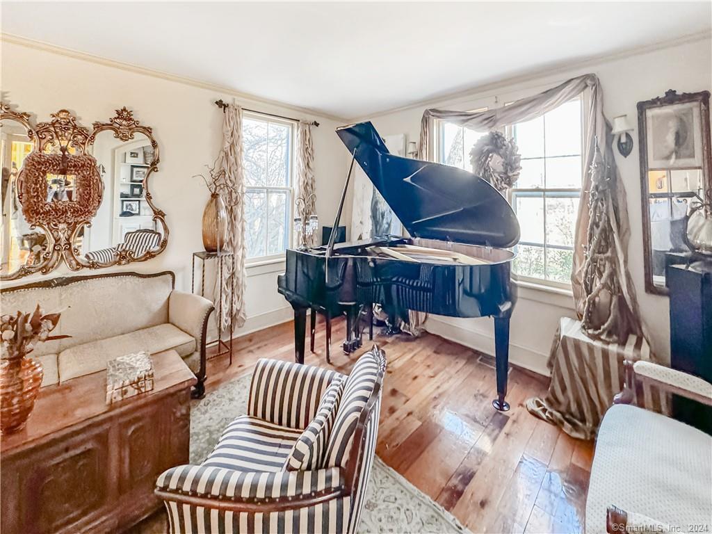 414 Riverside Avenue Westport, CT 06880 - Photo 16 of 40 a living room with furniture a wooden floor and next to a window