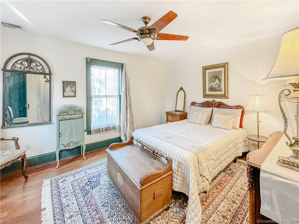 414 Riverside Avenue Westport, CT 06880 - Photo 18 of 40 a bedroom with a bed a table and chair