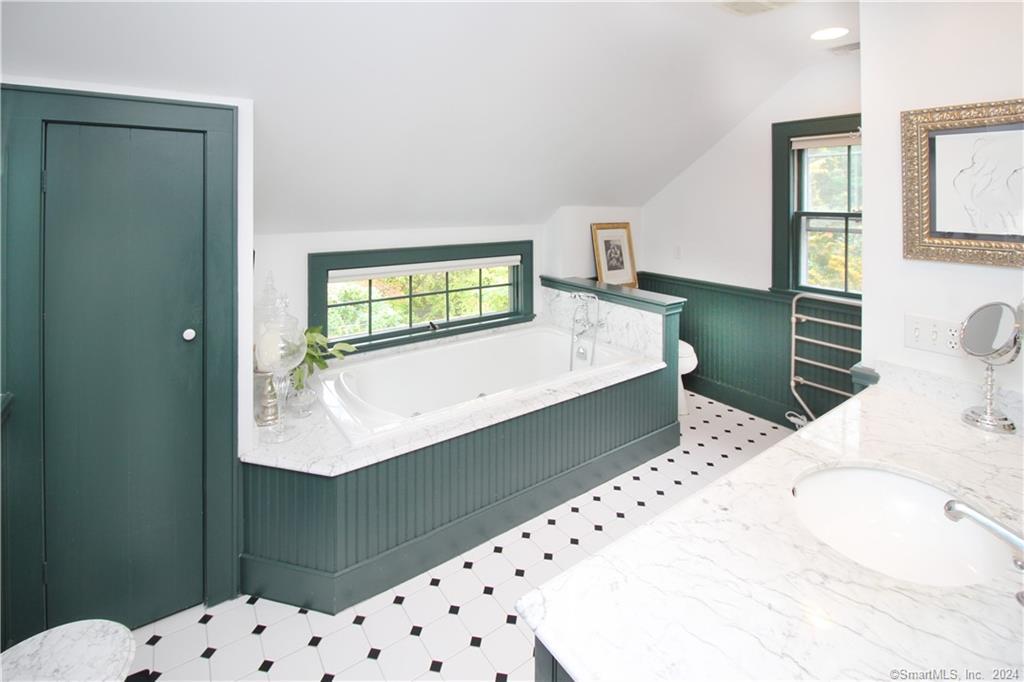 414 Riverside Avenue Westport, CT 06880 - Photo 20 of 40 a room with a bed and a dresser