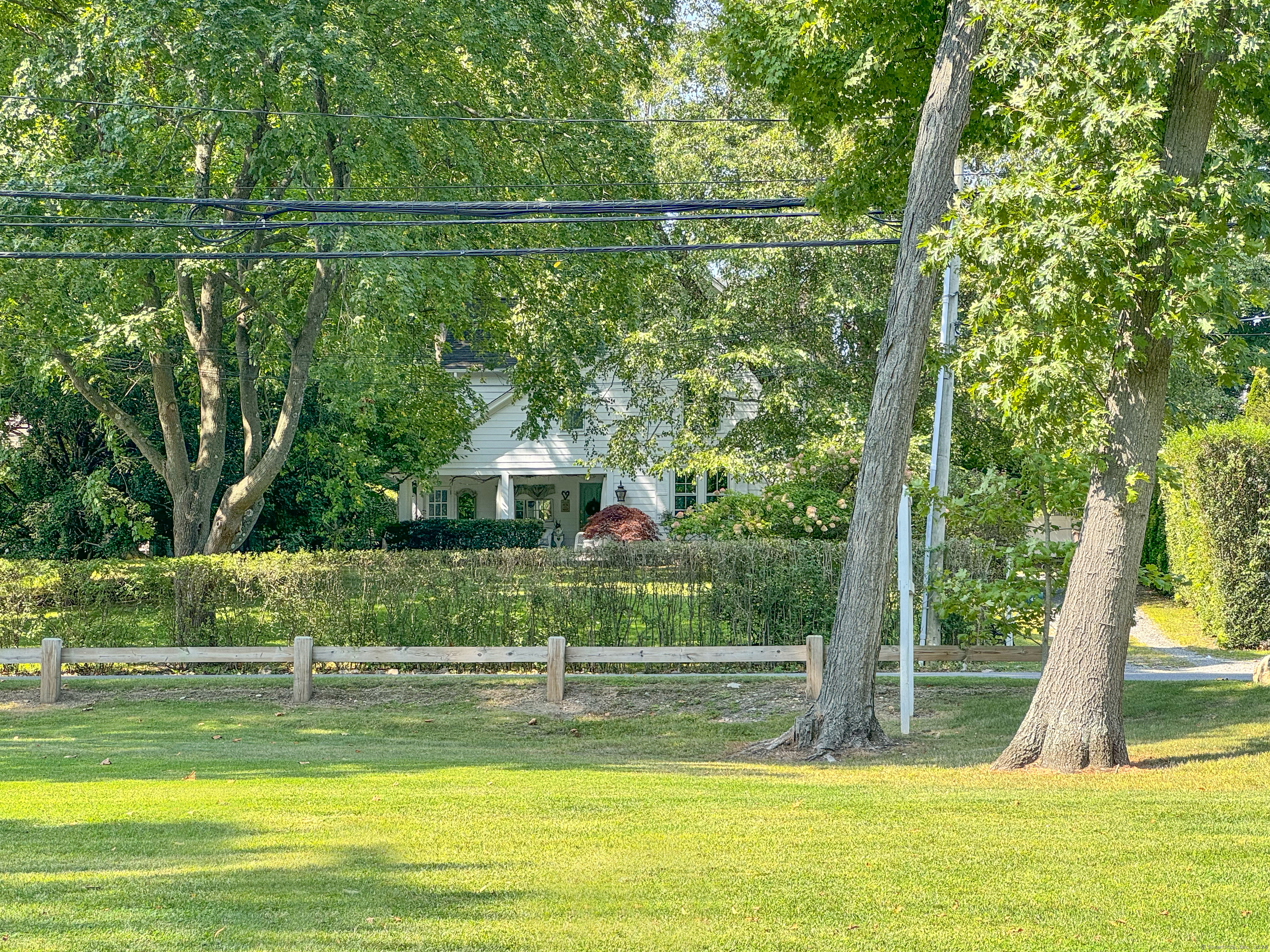 414 Riverside Avenue Westport, CT 06880 - Photo 2 of 40 a view of a swimming pool with a garden and plants