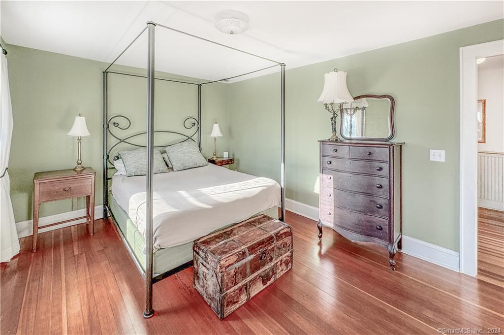 414 Riverside Avenue Westport, CT 06880 - Photo 21 of 40 a bedroom with a bed and wooden floor