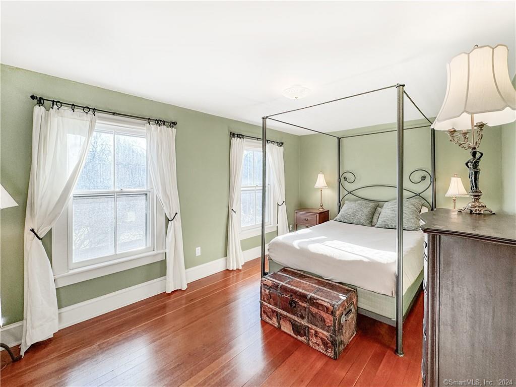 414 Riverside Avenue Westport, CT 06880 - Photo 22 of 40 a bedroom with a bed a window and mirror