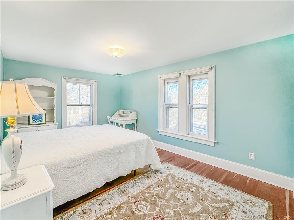 414 Riverside Avenue Westport, CT 06880 - Photo 24 of 40 a bedroom with a large bed and a window