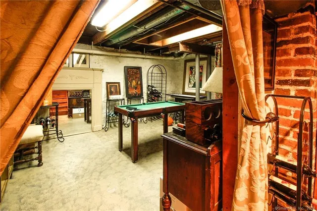 a bathroom with a toilet a sink and a mirror