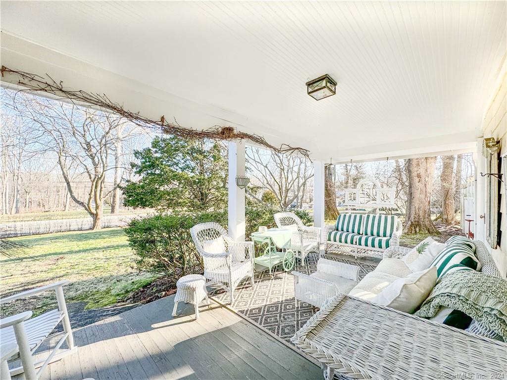 414 Riverside Avenue Westport, CT 06880 - Photo 30 of 40 a living room with furniture and a floor to ceiling window
