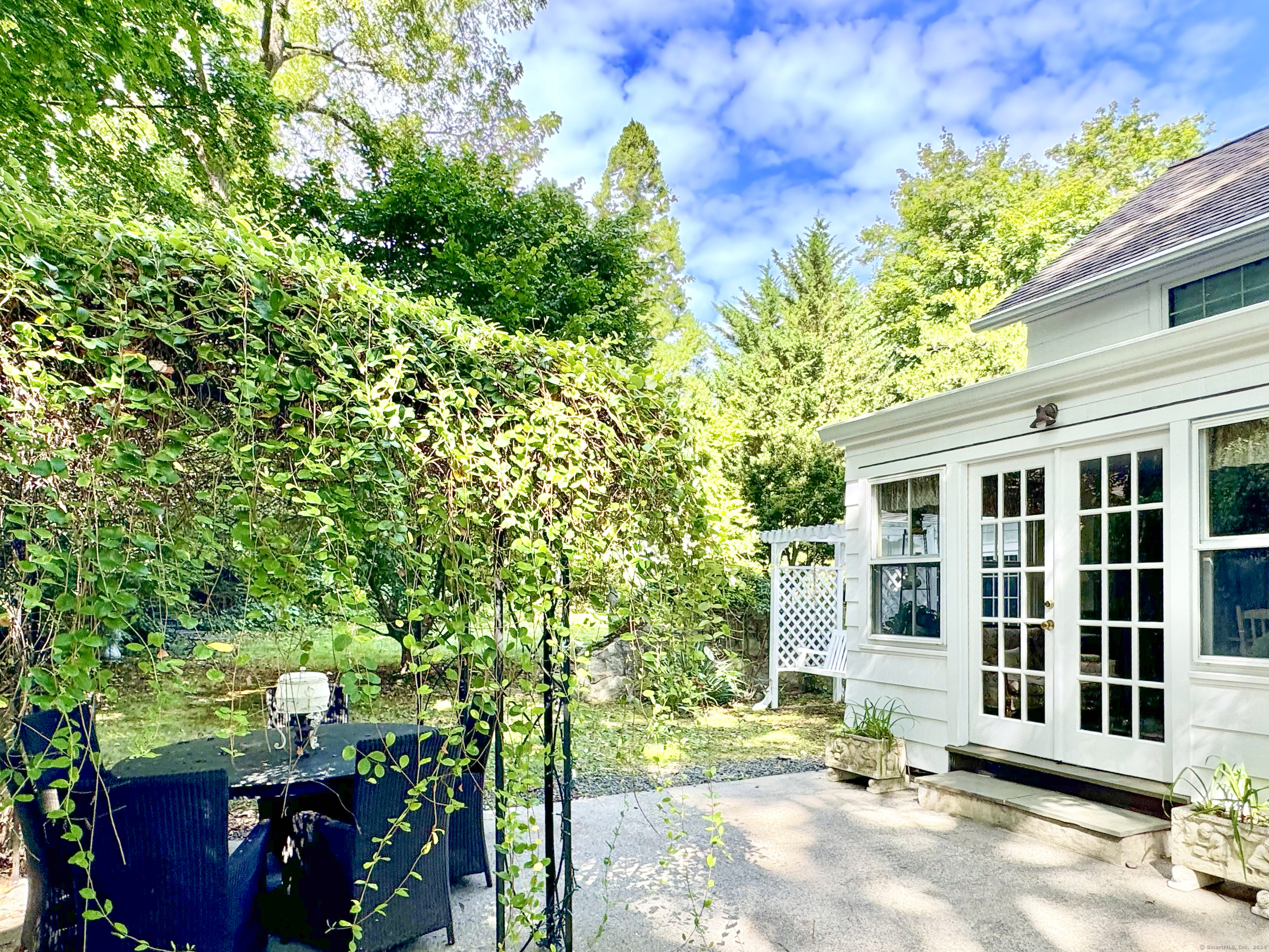 414 Riverside Avenue Westport, CT 06880 - Photo 32 of 40 a front view of a house with a yard