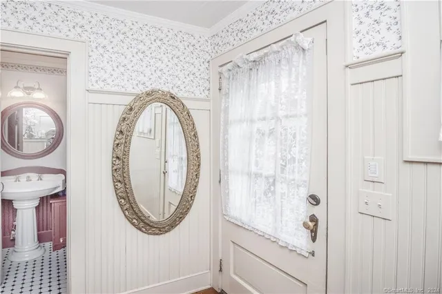 a bathroom with a mirror and a shower
