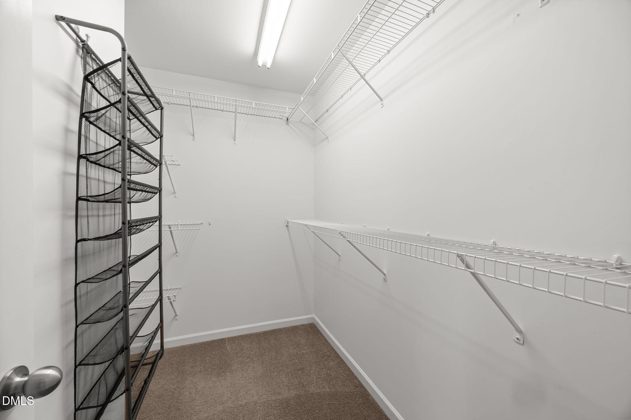 401 Stone Flower Lane Raleigh, NC 27603 - Photo 14 of 28 a view of a room with racks on the wall