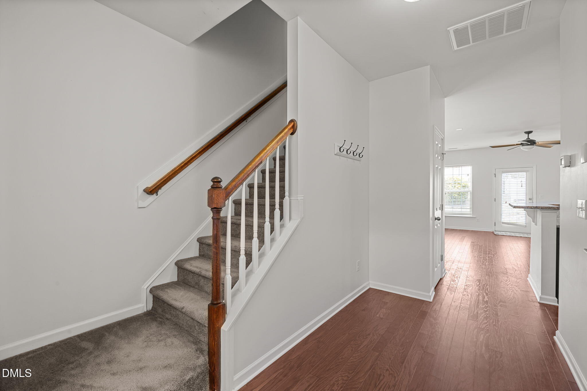 401 Stone Flower Lane Raleigh, NC 27603 - Photo 3 of 28 a view of an entryway with wooden floor