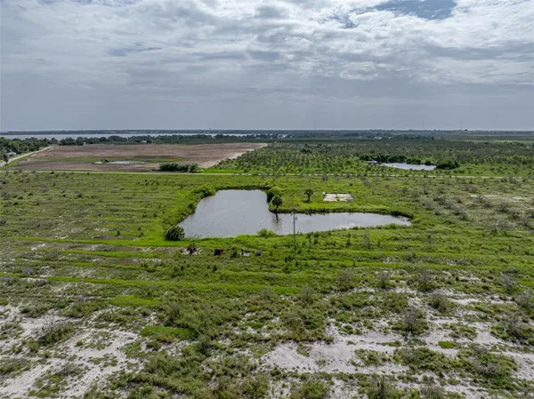 a view of a lake with a big yard