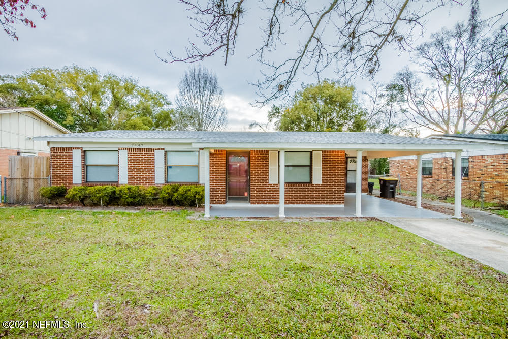 7447 Wheat Road Jacksonville, FL 32244 - Photo 1 of 42 front view of a house with a big yard