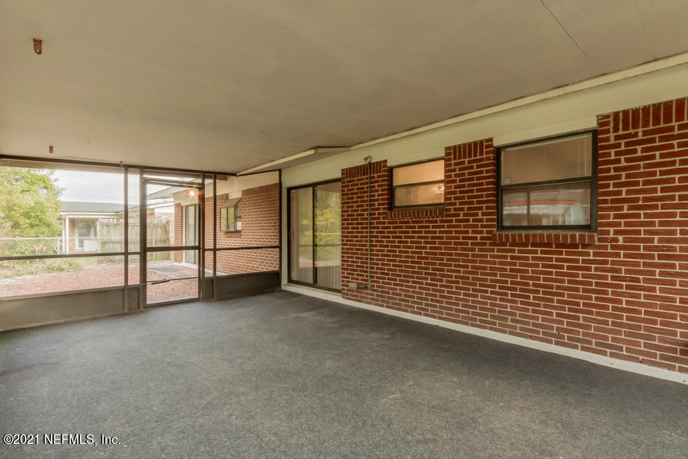 7447 Wheat Road Jacksonville, FL 32244 - Photo 41 of 42 a view of an empty room with a balcony
