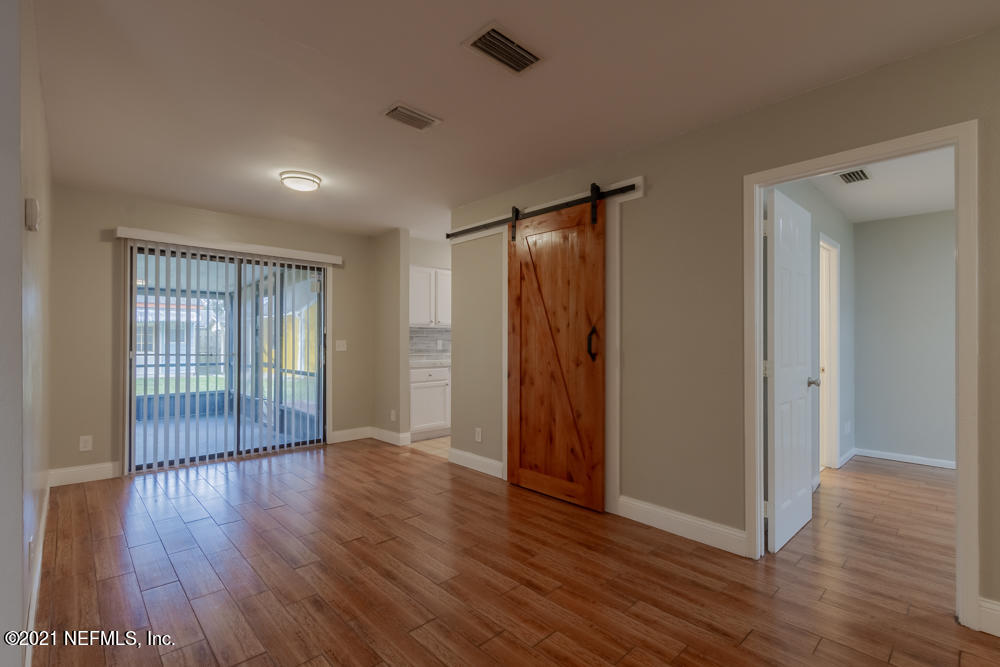 7447 Wheat Road Jacksonville, FL 32244 - Photo 9 of 42 a view of entryway with wooden floor