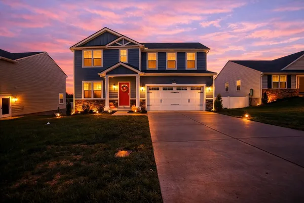 a front view of a house with a yard