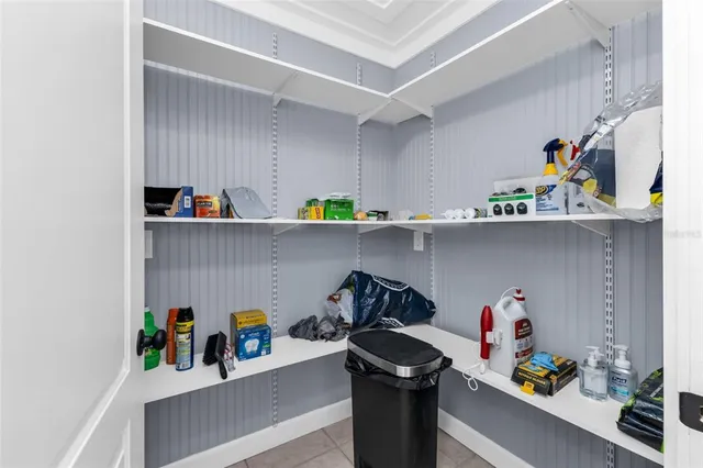 a kitchen with a stove top oven and cabinets