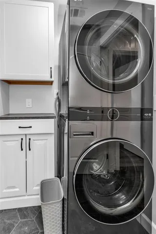 a view of a room with wooden floor and window