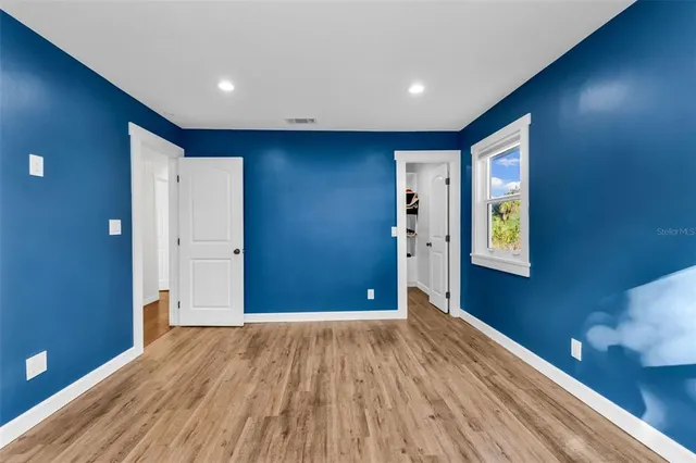 a view of a yard with palm trees