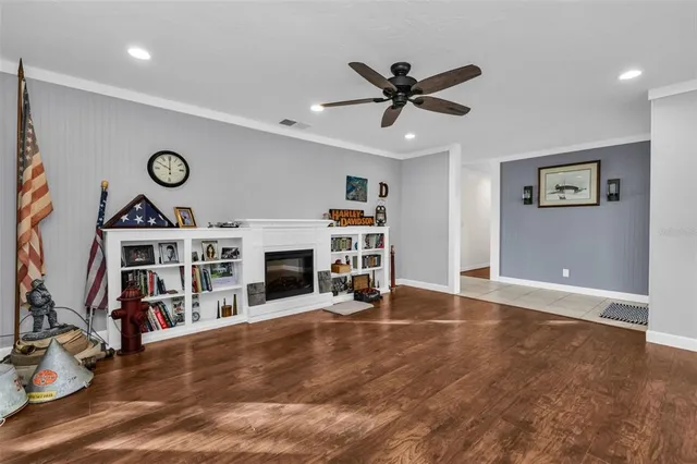a view of a room with furniture entryway and wooden floor
