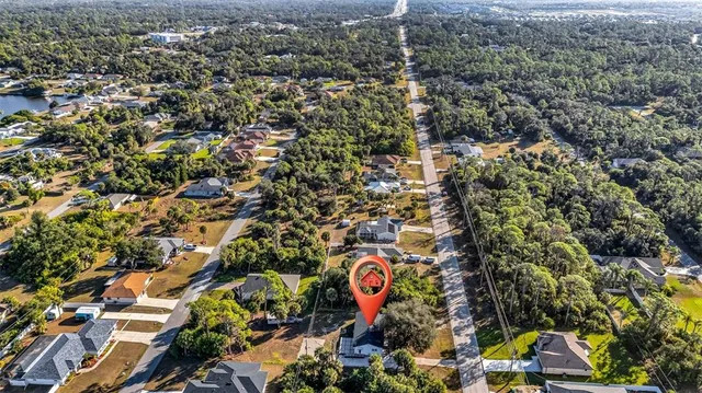 an aerial view of residential building with green space