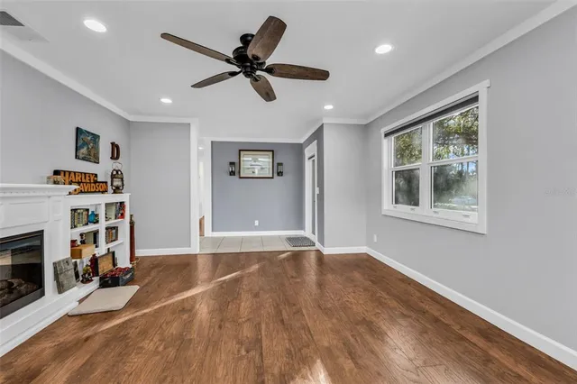 a view of a livingroom with a ceiling fan and a window