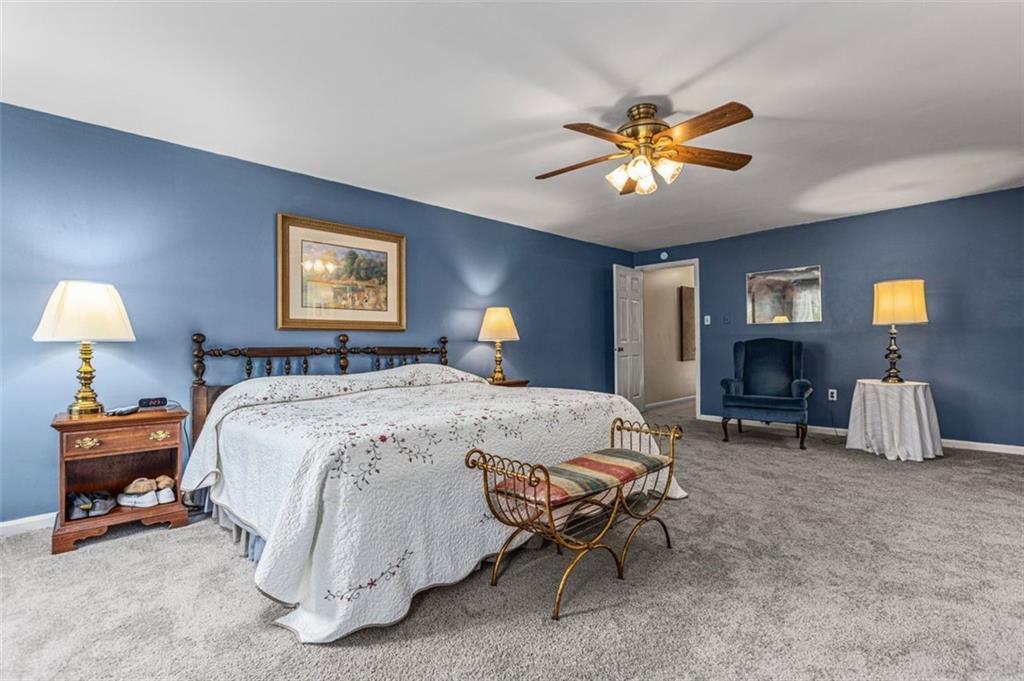 1573 Pineview Drive Pittsburgh, PA 15241 - Photo 18 of 21 a bedroom with a bed and a chandelier